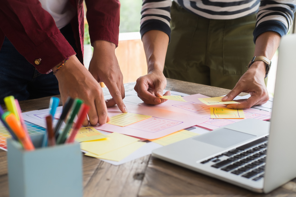 Businesspeople Collaborating and Using Post-Its